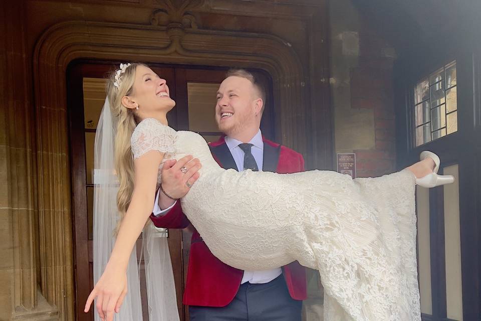 Groom picking up bride