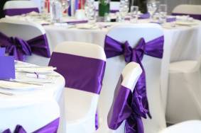 White Covers with Cadbury Purple Silk Sashes