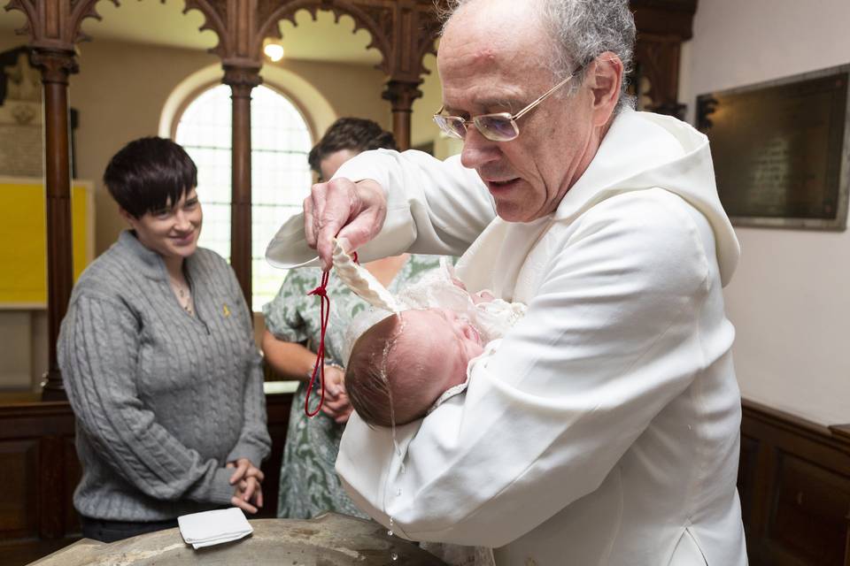 A baby been baptise.