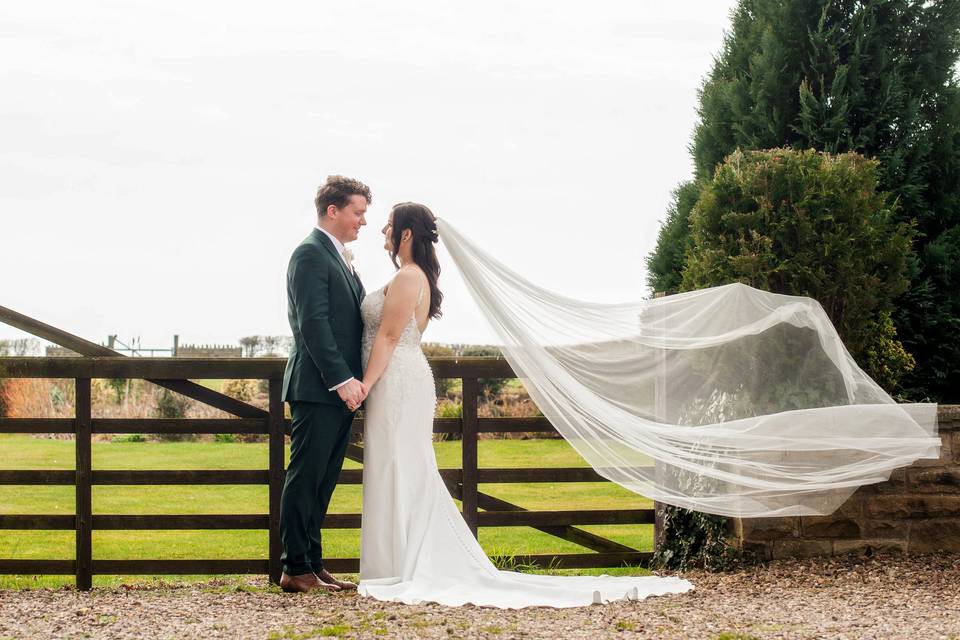 Couple with Veil in Wind