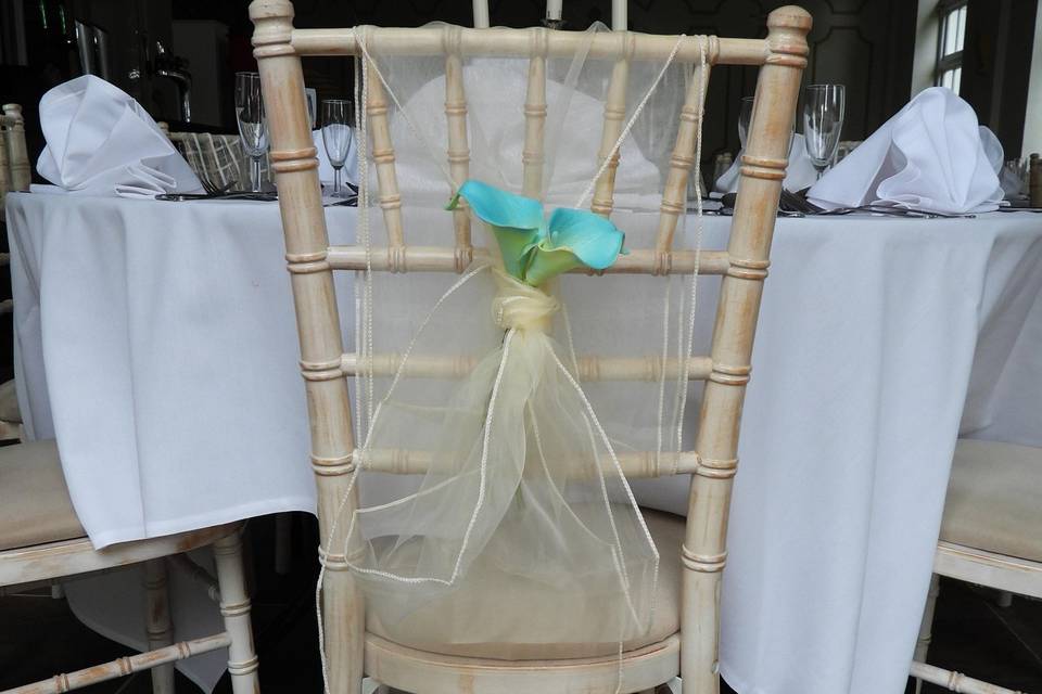 Ivory chair sash with flower