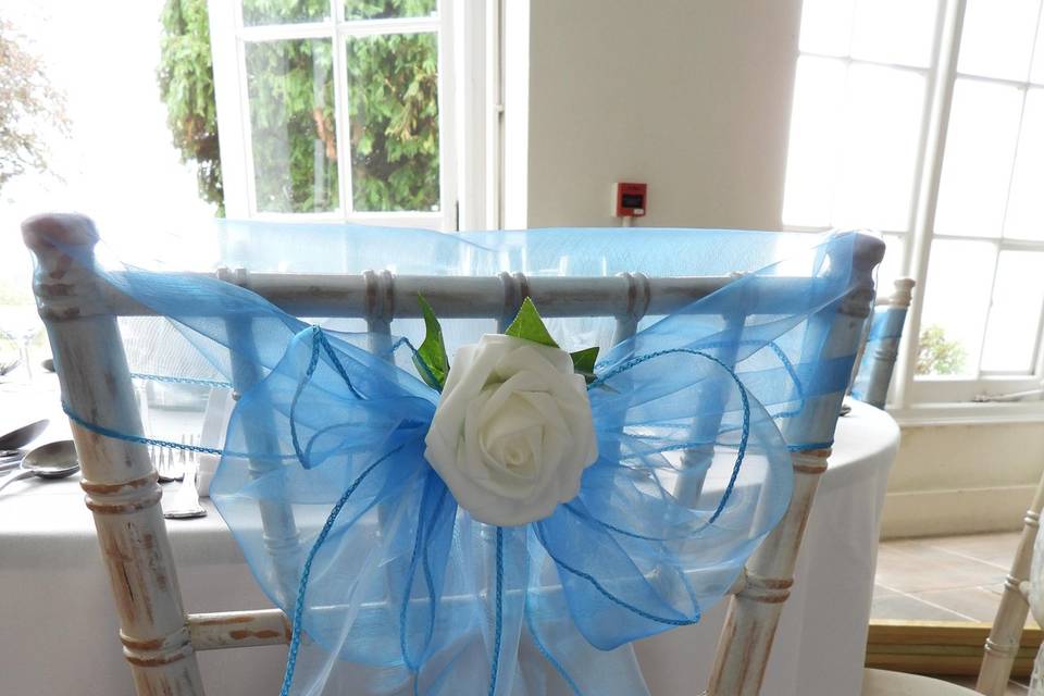 Turquoise chair sash over top