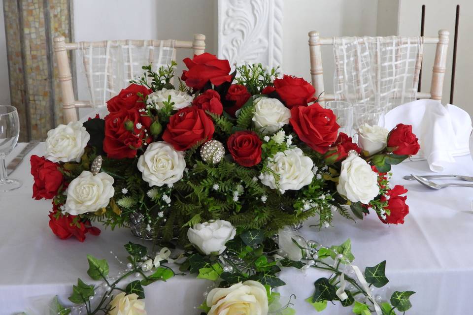 Red and white roses top table