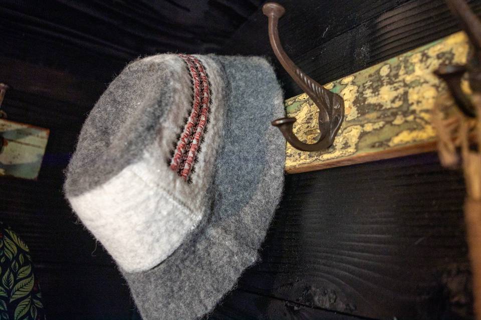 Felt hat on wooden hook