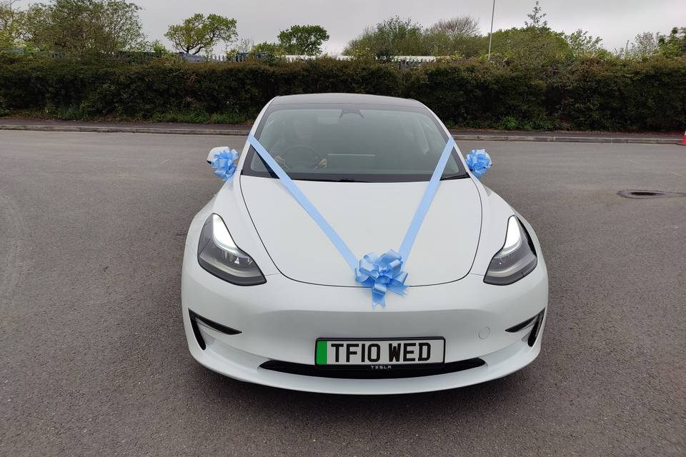 Blue ribbon over car