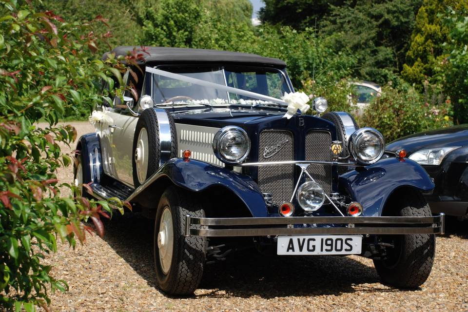 Vintage car outside house