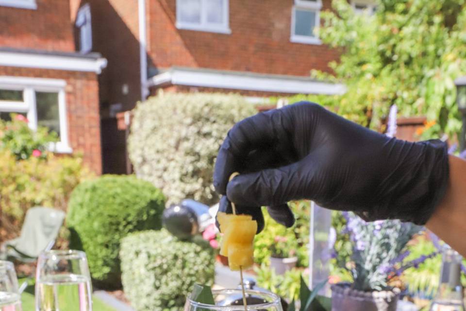 Garnishing cocktail with fruit