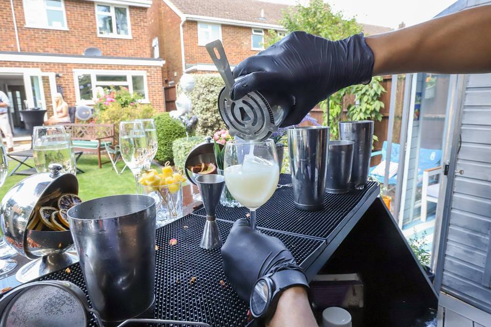 Pouring drink over ice