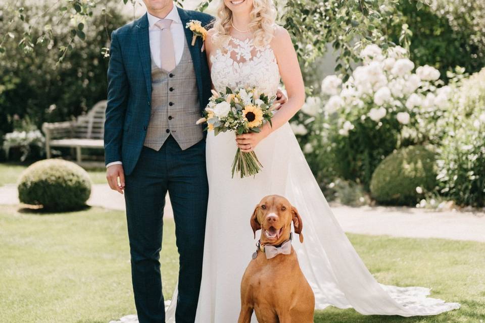 Newlyweds and their happy pup