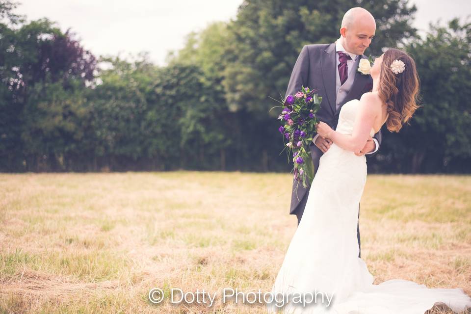 Couple in a field - Dotty Photography