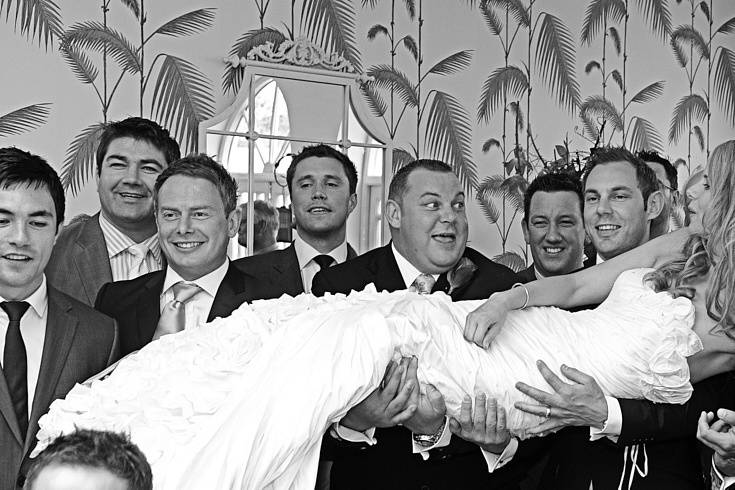 Rugby players with bride