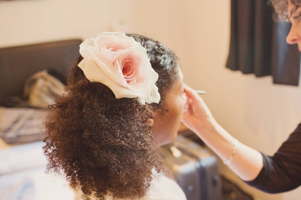 Natural and curly with a floral accessory