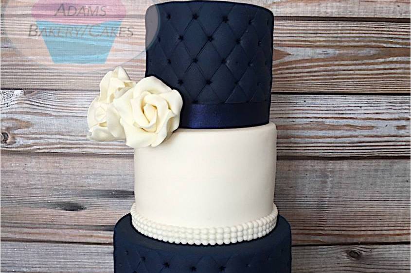 4 tier navy blue and white cak