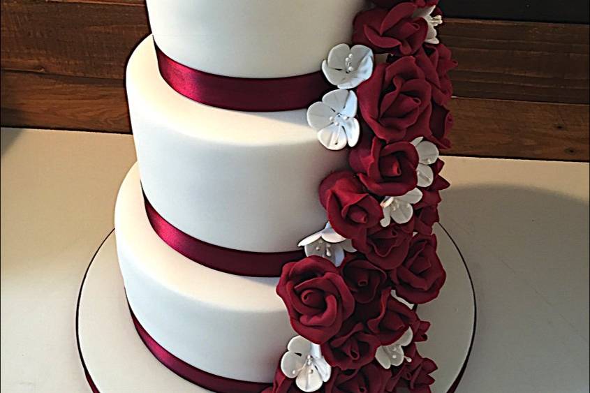 Burgundy Cultured Pearl Wedding Cake Classic Five tier wedding cake  decorarated with pearls and hand crafted sugar roses.