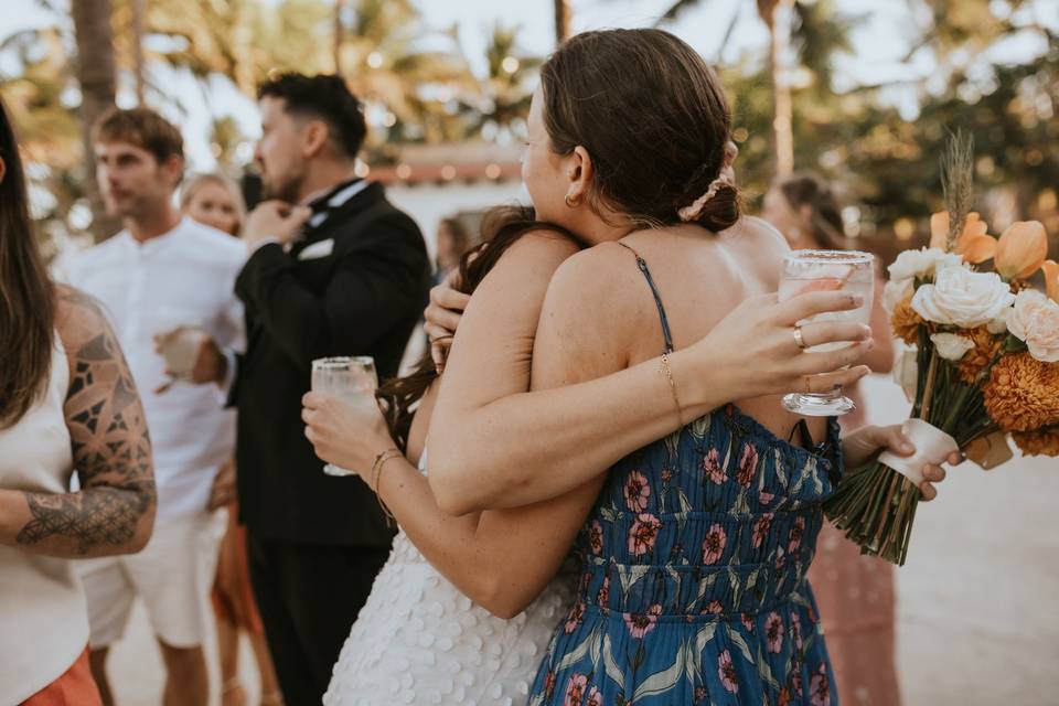 Hugging bride after ceremony