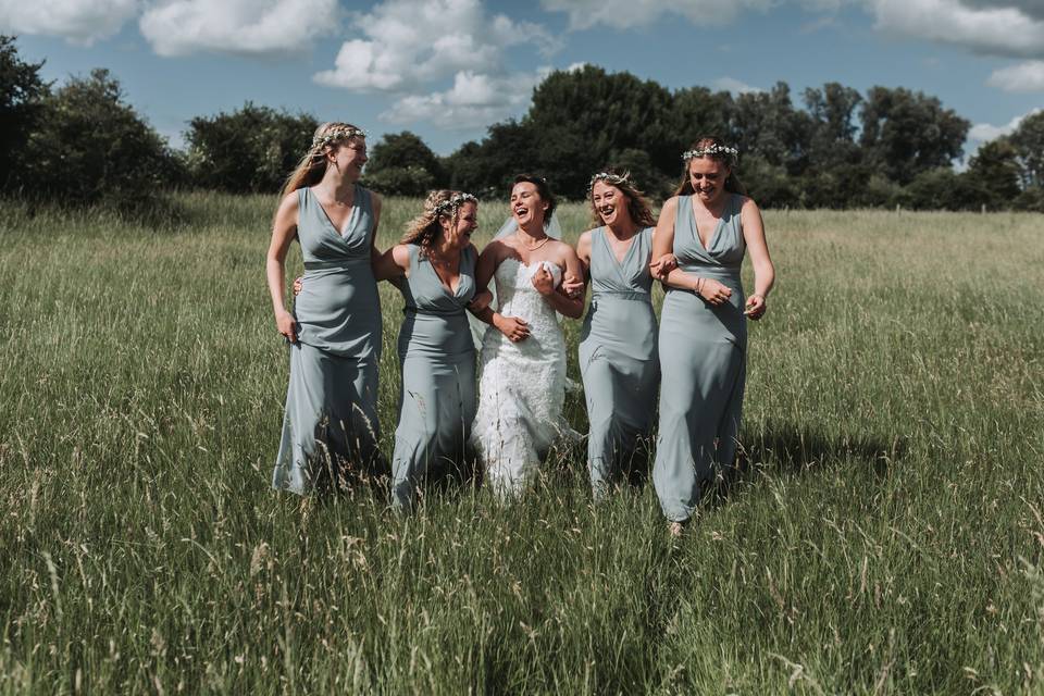 Bridesmaids in field