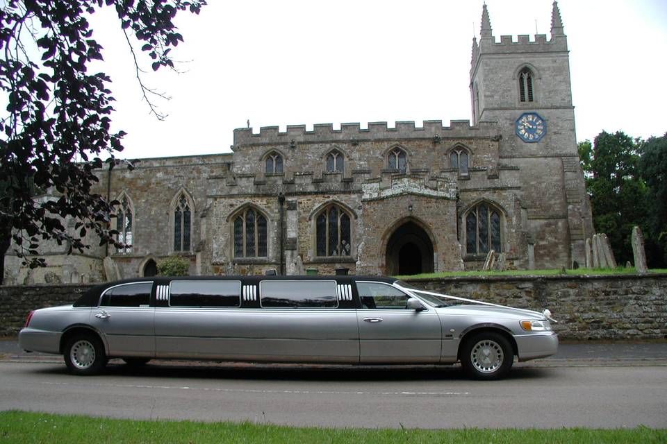 Car in front of old building