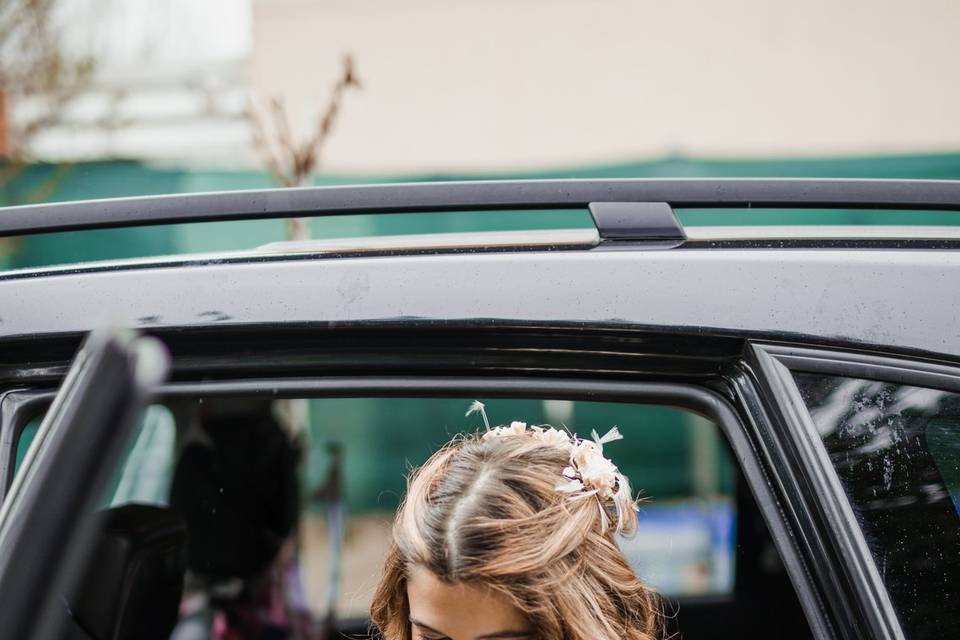 Bride entering the car