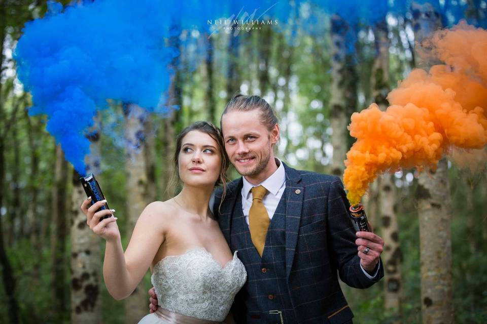 Couple with colourful smoke