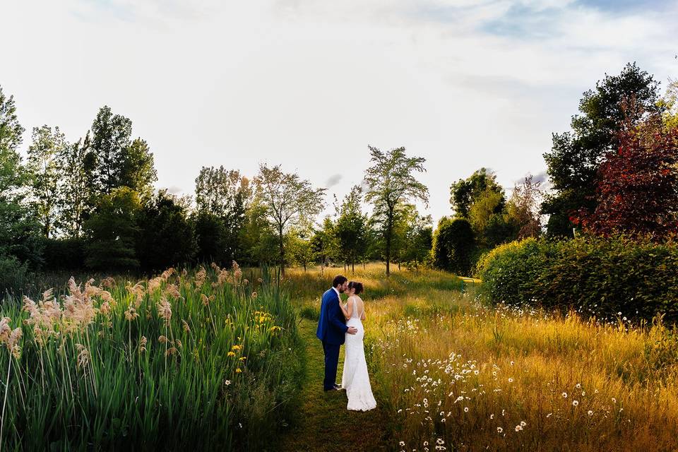 Bride and Groom in wildflowers