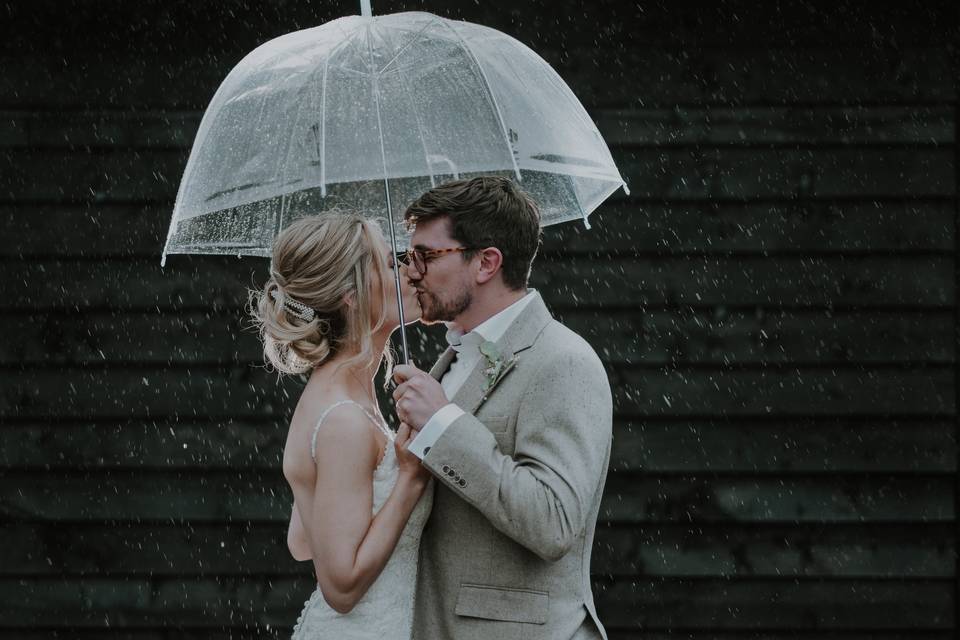 Rain fall bride and groom