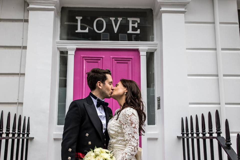 Bride & Groom outside Love sig