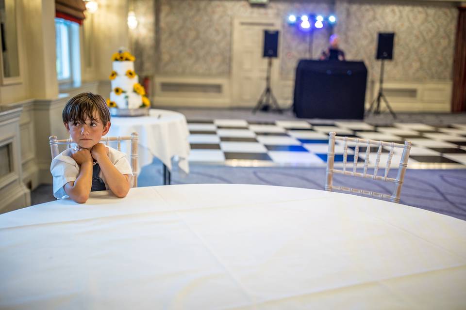 Boy waits at the table.