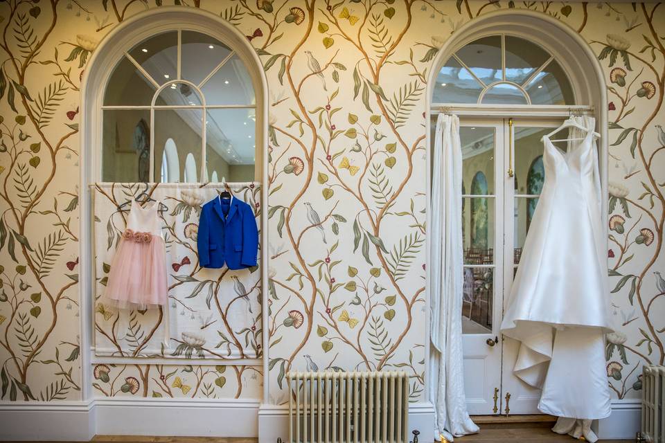 The bride's dress hangs neatly