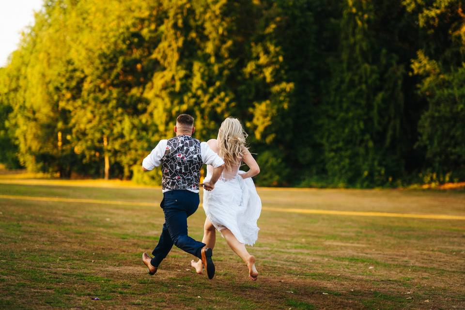 Bride and groom running