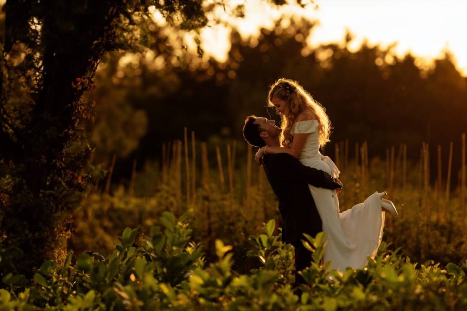 Groom lifting his wife