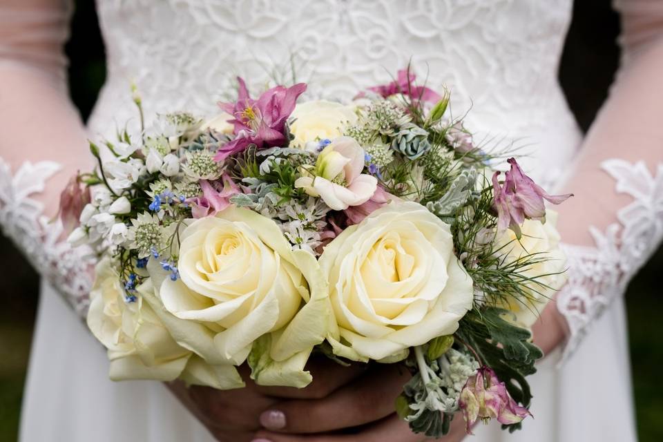 Bride holding a bouquet - Creating Diamonds Wedding Photography