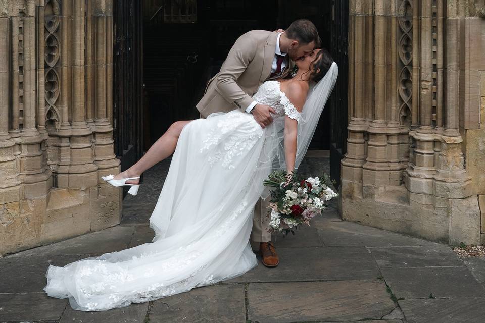 Bride and groom kiss