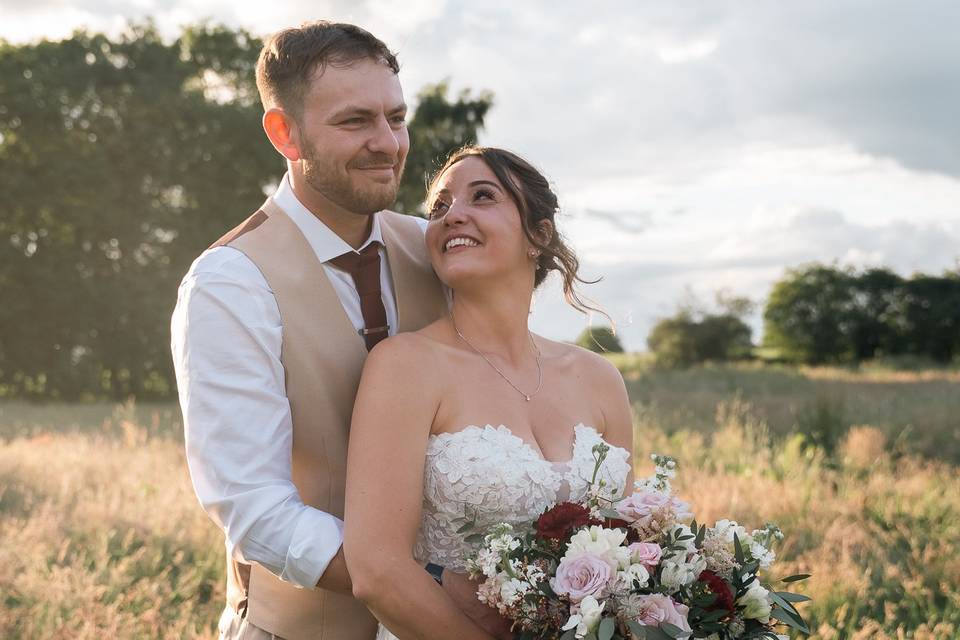 Bride and groom during sunset