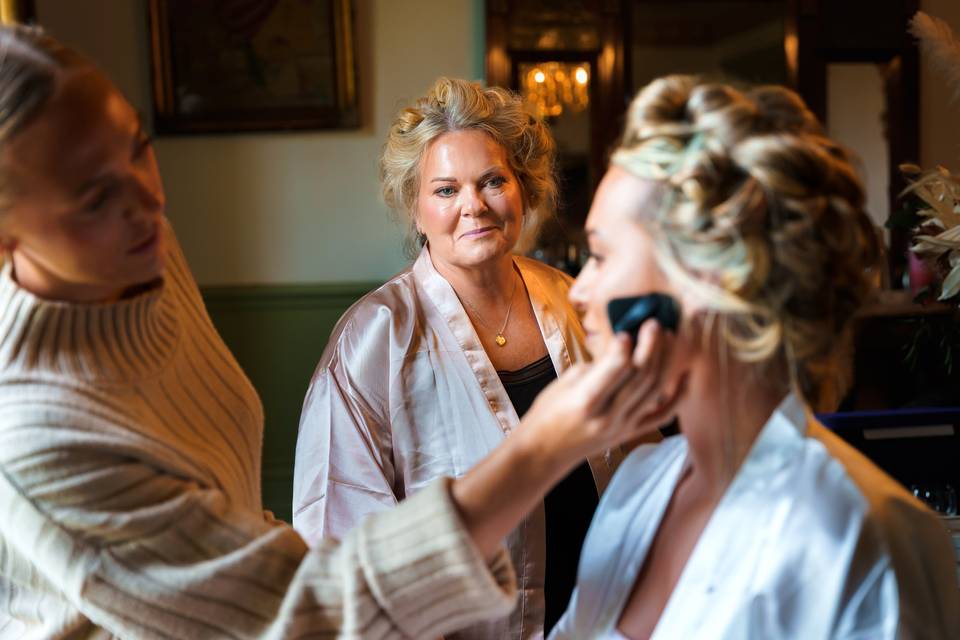 Mum watching bride prep