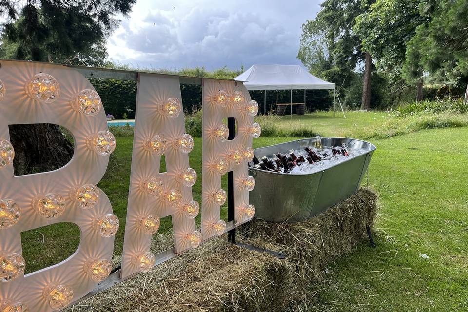 Bucket beer and bar sign!