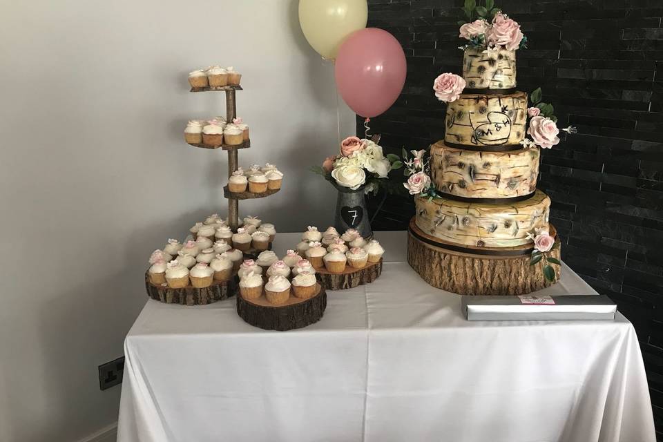 Wedding cake and cupcakes