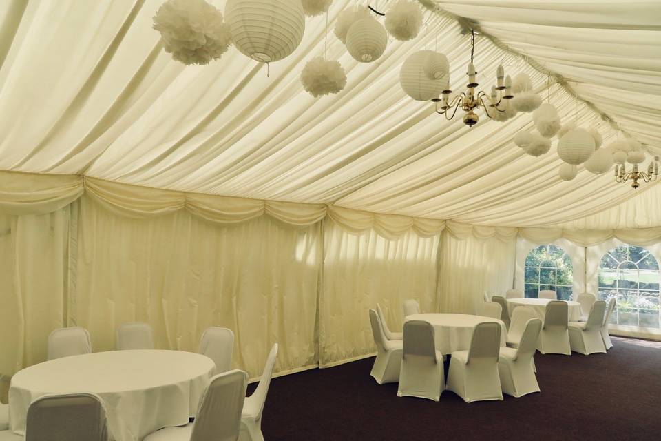 Marquee with dressed tables and chairs