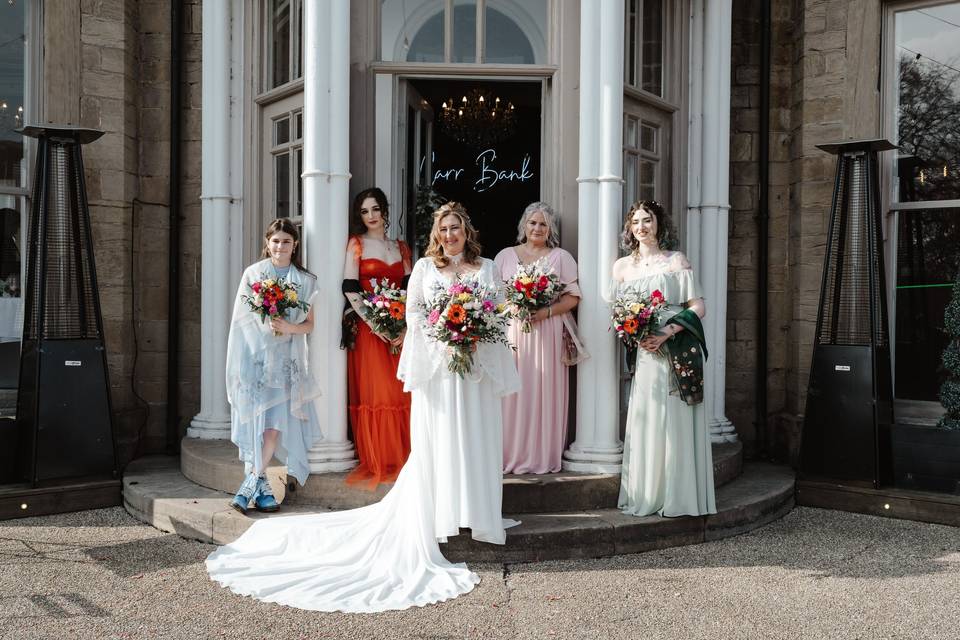 Bridal party front of house
