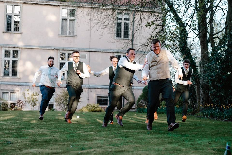Grooms men running for beer