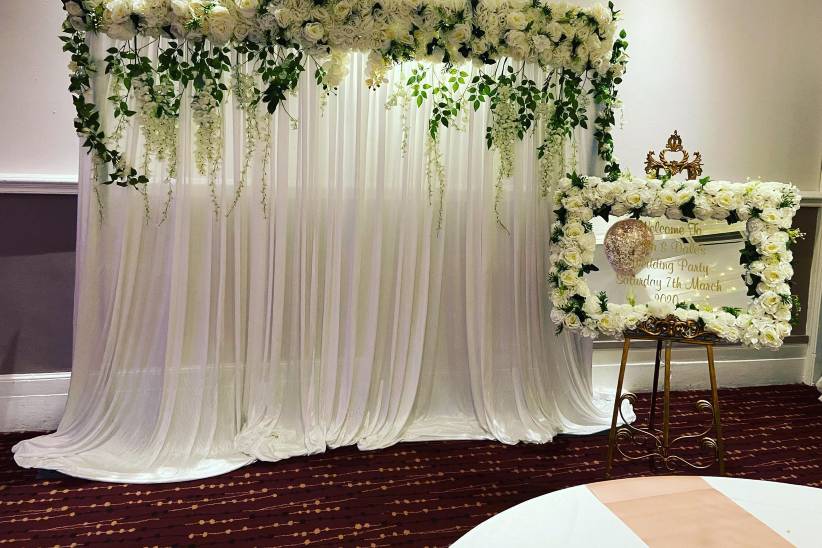 Wedding drapes and flower wall