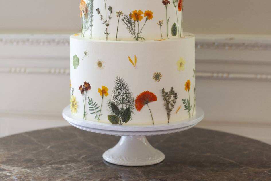 Pressed flowers on buttercream