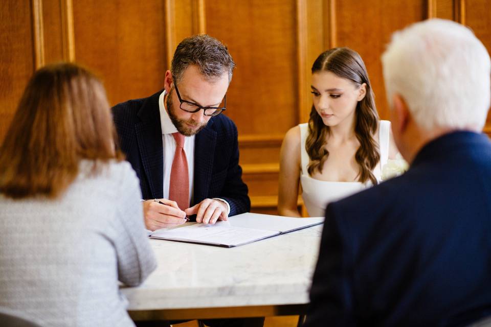 Signing the papers