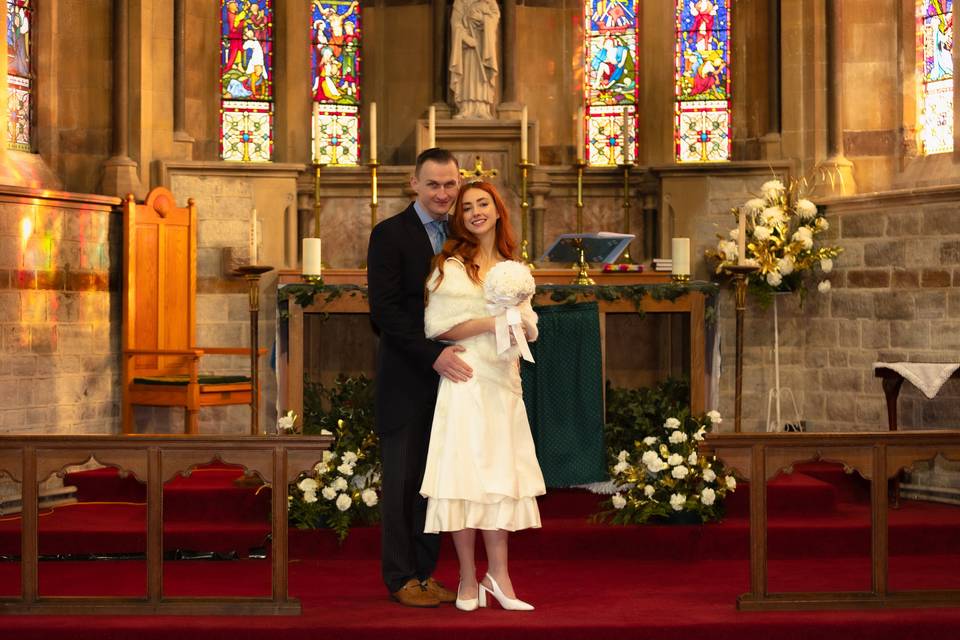 Claire and Sam at the altar