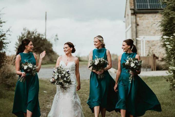 Matching teal dresses.