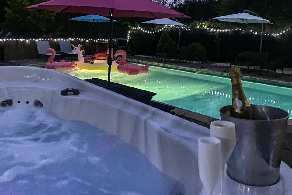 Pool and hot tub by night
