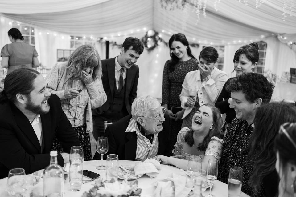 Wedding guests laughing