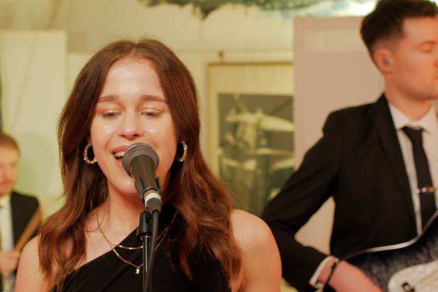 Kate with the band on vocals