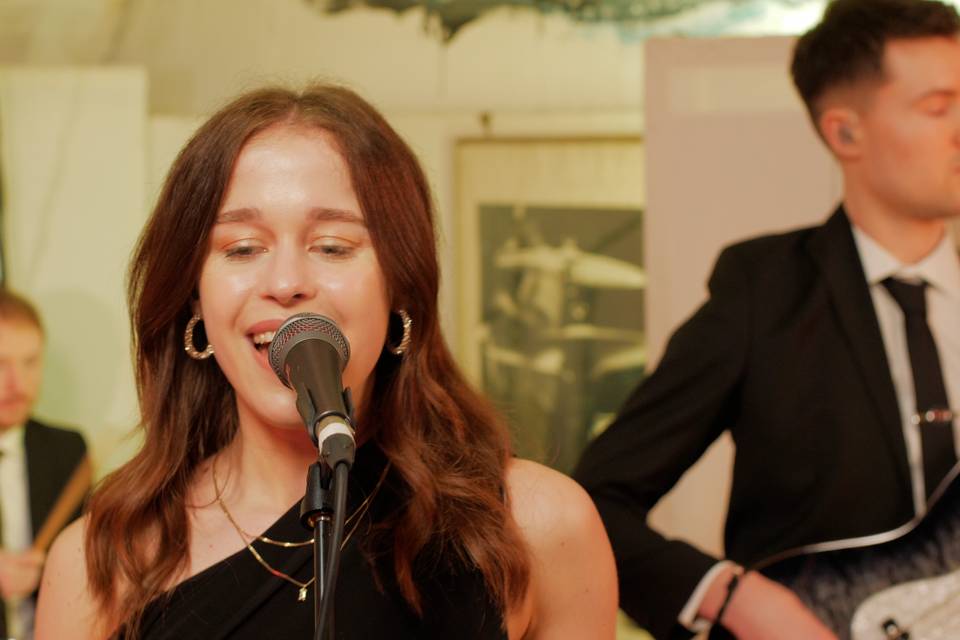 Kate with the band on vocals