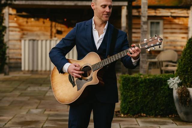 Wedding guitarist in suit