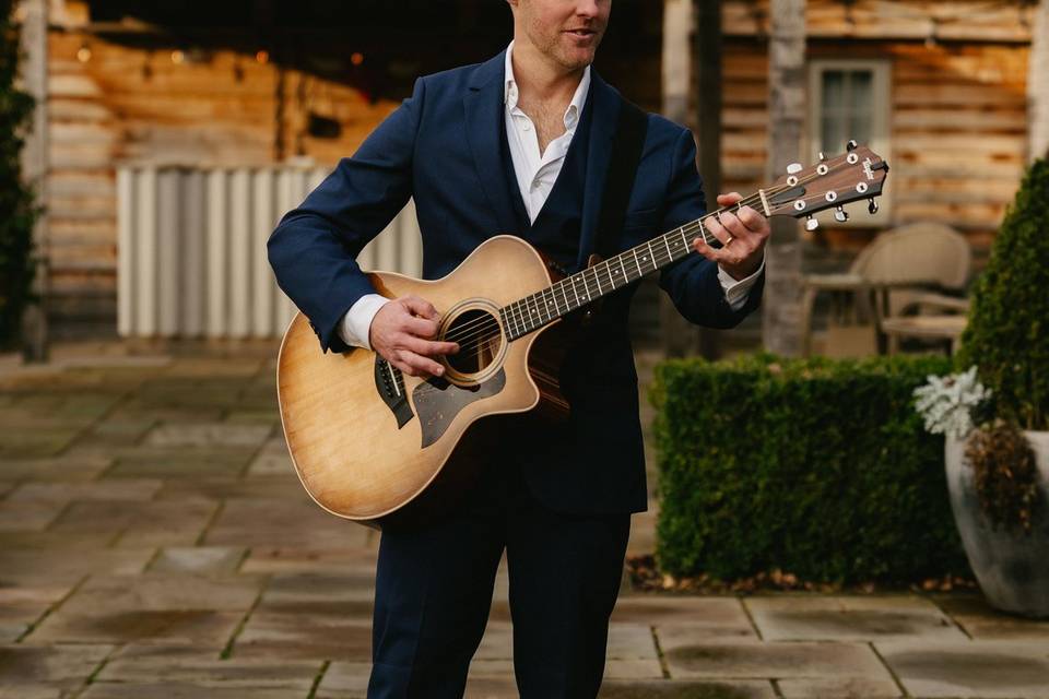 Wedding guitarist in suit